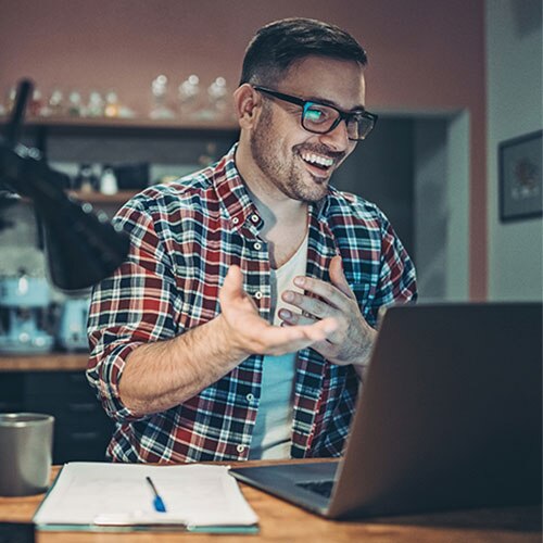 Happy man on his laptop